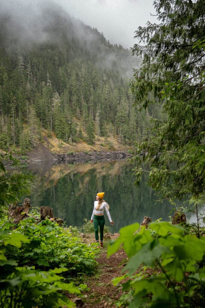 woman-on-lush-green-trail-leading-to-lena-lake