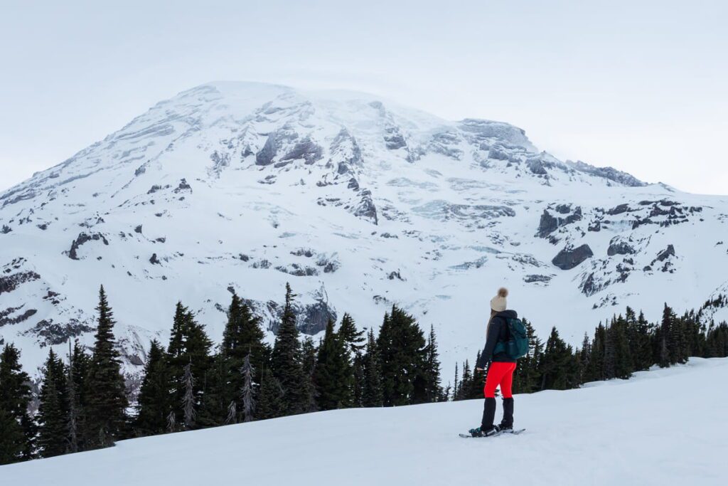 woman-snowshoeing-at-mt-rainier-national-park-in-winter